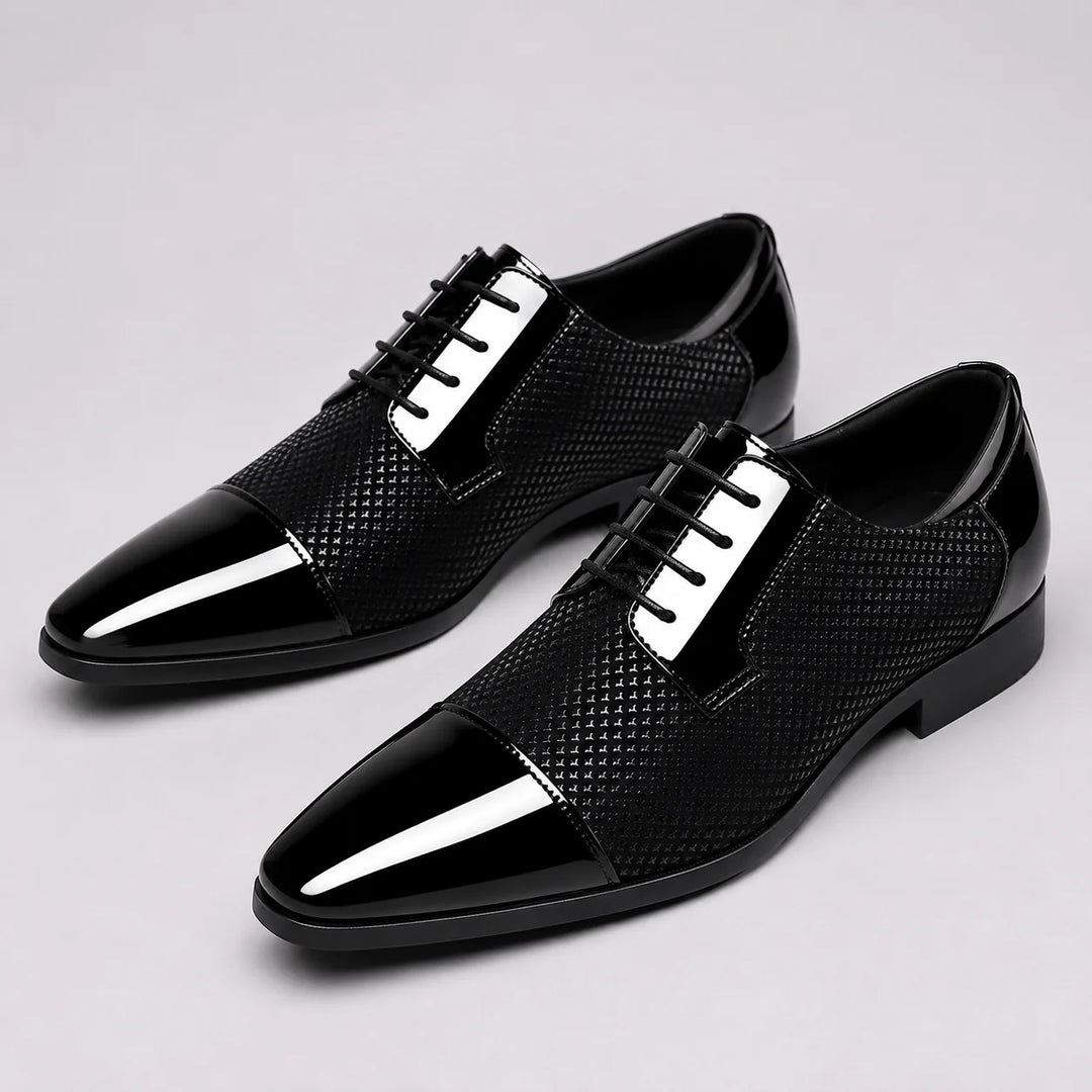 Pair of lace-up Oxford shoes featuring glossy finish and classic cap toe design