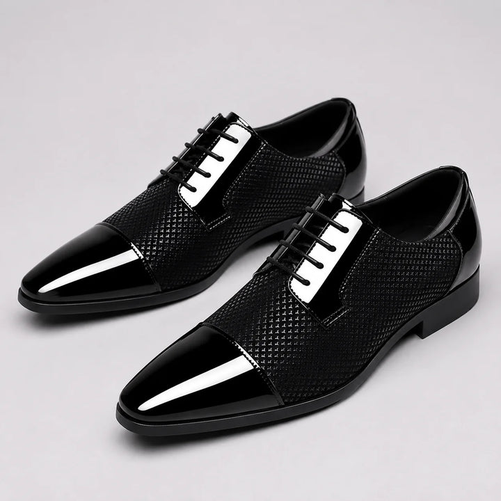 Pair of lace-up Oxford shoes featuring glossy finish and classic cap toe design