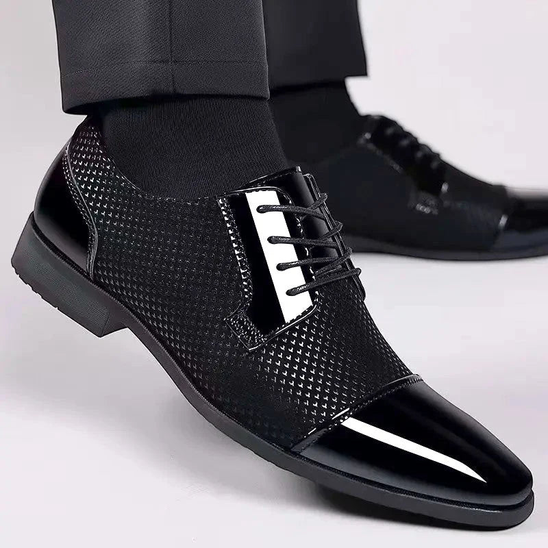 Detail shot of Oxford dress shoes showing tonal laces and polished patent finish