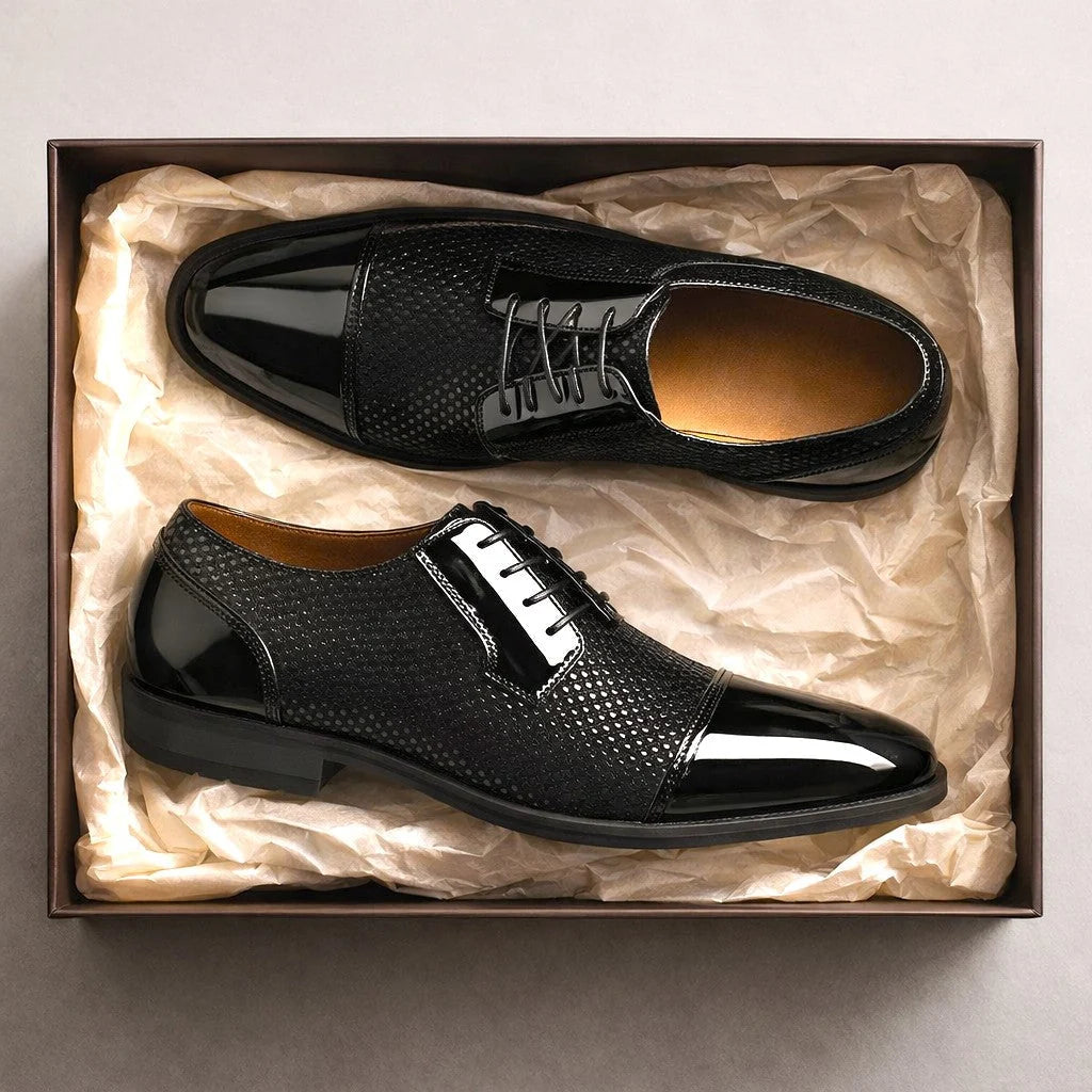 Navy blue men's Oxford shoes with structured cap toe and textured mesh inserts
