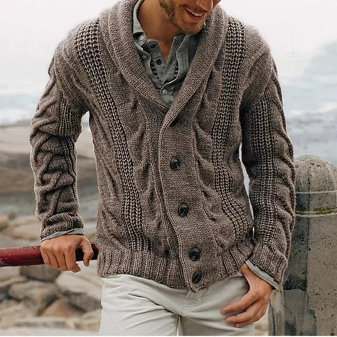 Close-up view of cable knit texture and shawl collar detail on men's cardigan