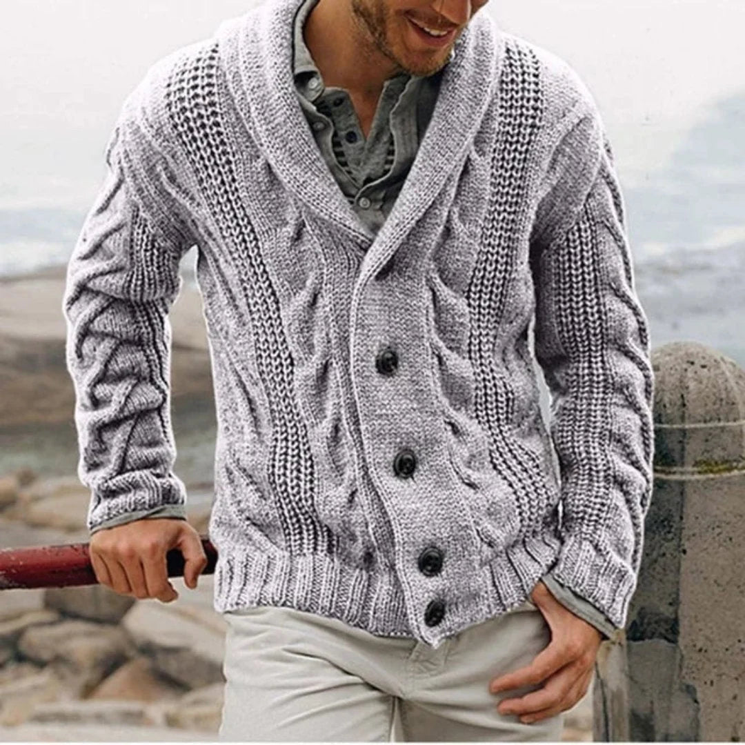 Detail shot of button placket and cable knit construction on men's cardigan
