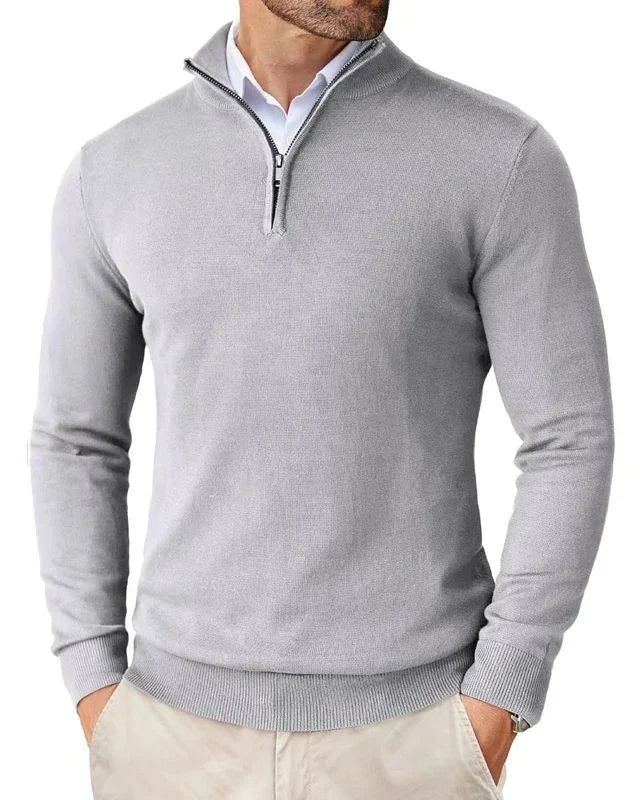 Detail shot of men's half-zip jumper ribbed cuffs and hem detailing