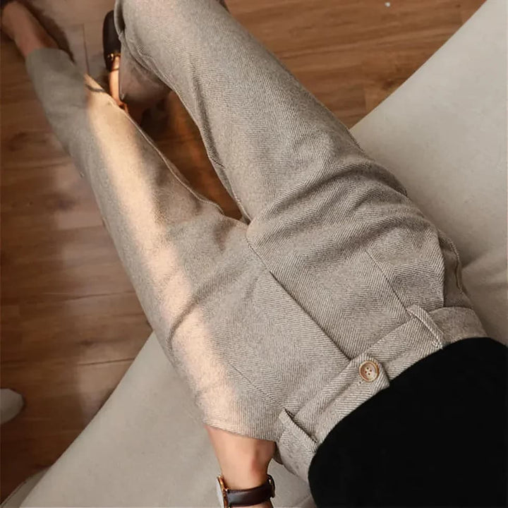 Men's brown herringbone trousers styled with casual jumper for smart-casual look
