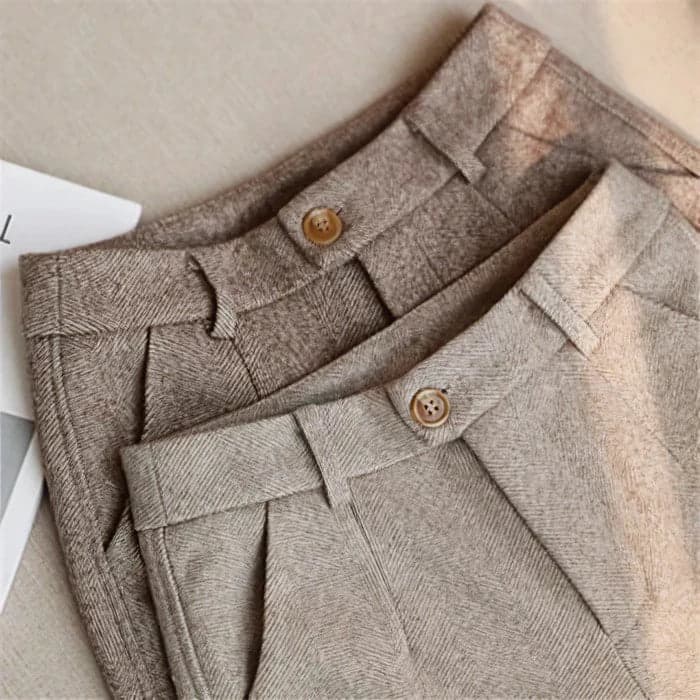 Full-length view of men's herringbone trousers showing classic tailored silhouette