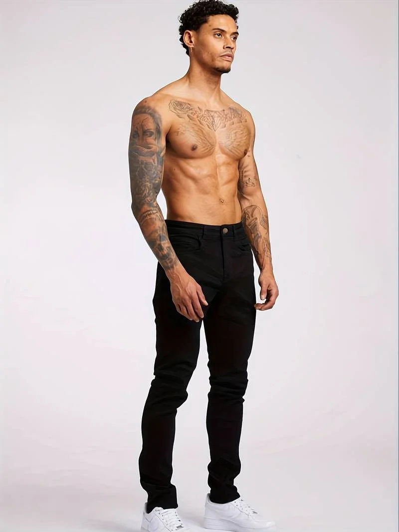 Full-length view of men's tapered jeans with faded wash through thighs
