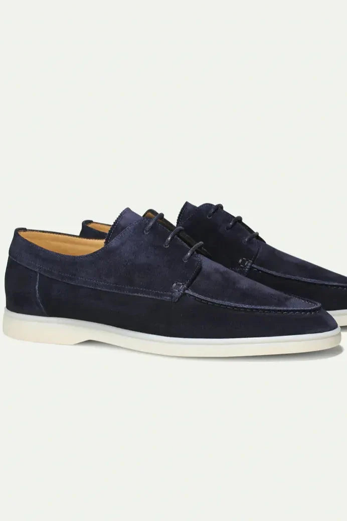 Close-up of suede-look finish on men's lace-up loafers highlighting soft texture and refined appearance