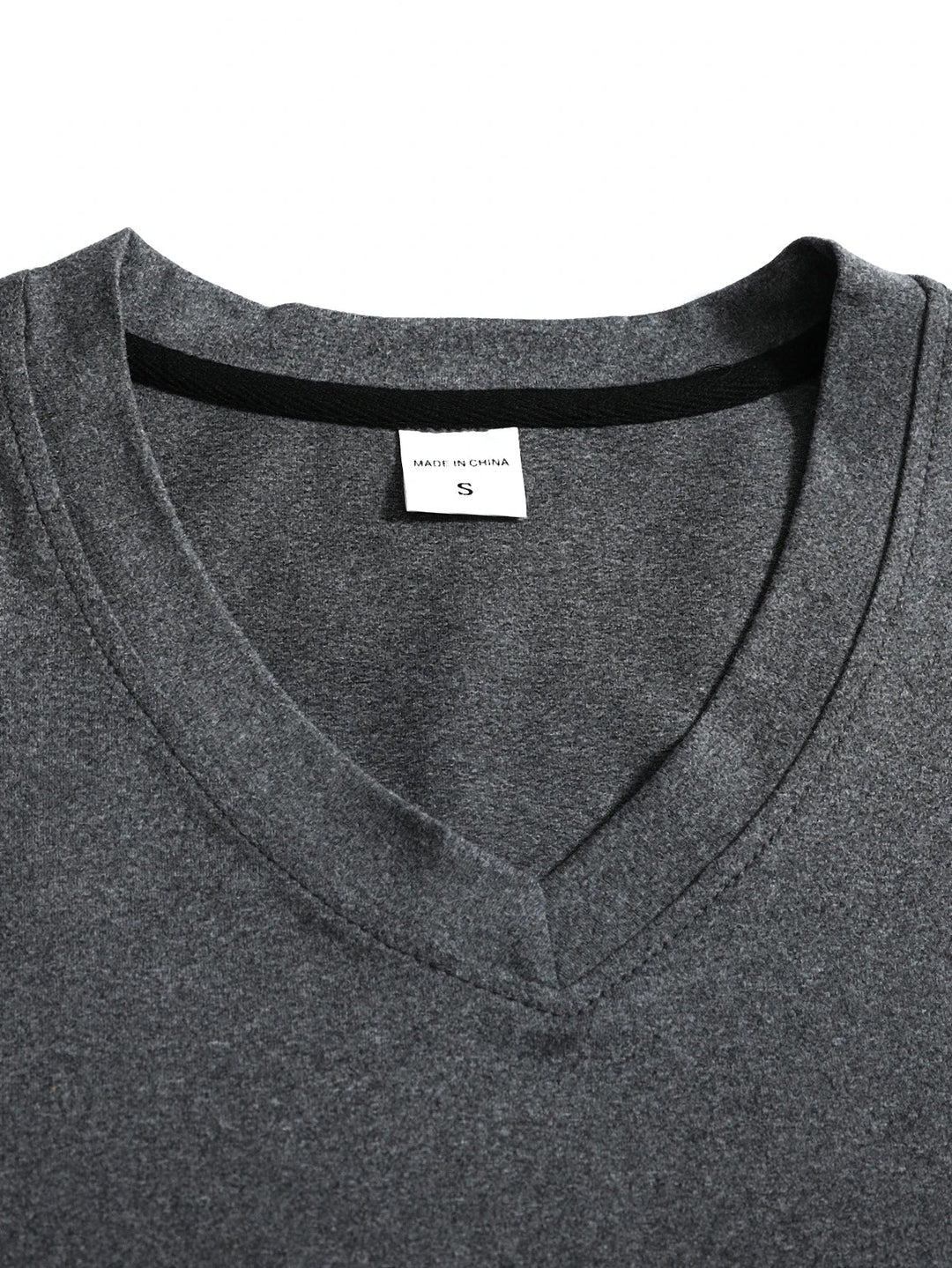 Side angle of men's v-neck long sleeve t-shirt displaying relaxed fit and sleeve length