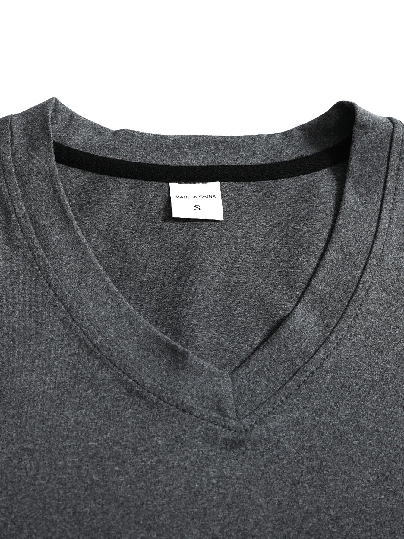 Side angle of men's v-neck long sleeve t-shirt displaying relaxed fit and sleeve length