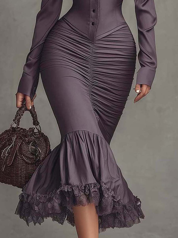 Detail shot of lace trim finish at hem and neckline on ruched satin midi dress