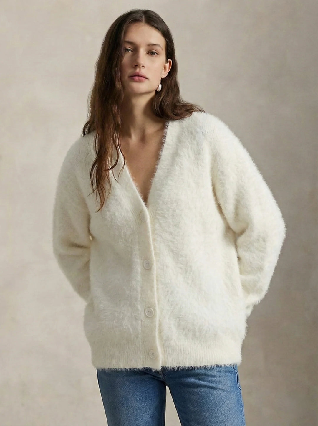 Back view of women's cashmere cardigan showing oversized dropped shoulder fit