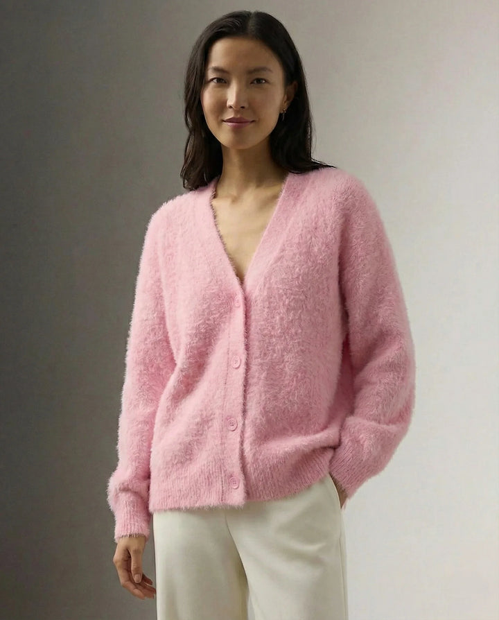 Close-up of button-front closure detail on women's fluffy cardigan