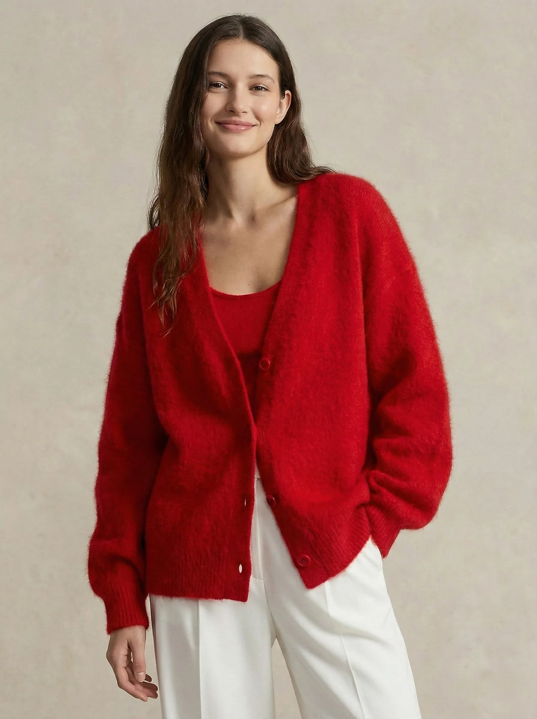 Detail shot of V-neckline and plush texture on cashmere cardigan