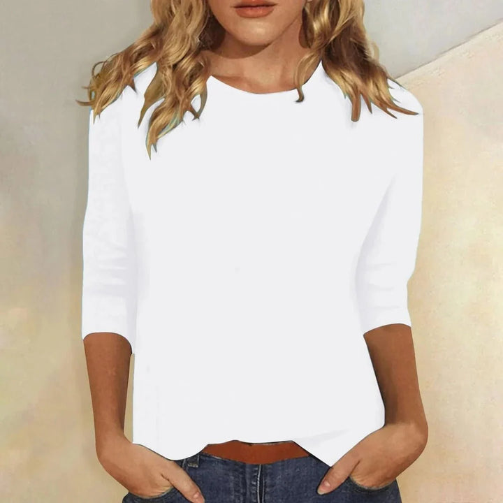 Close view of women's crew neck top showing round neckline and smooth fabric finish