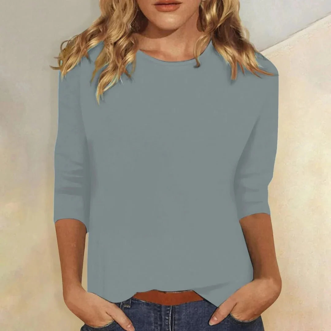 Women's pink crew neck top styled casually with jeans for everyday wear