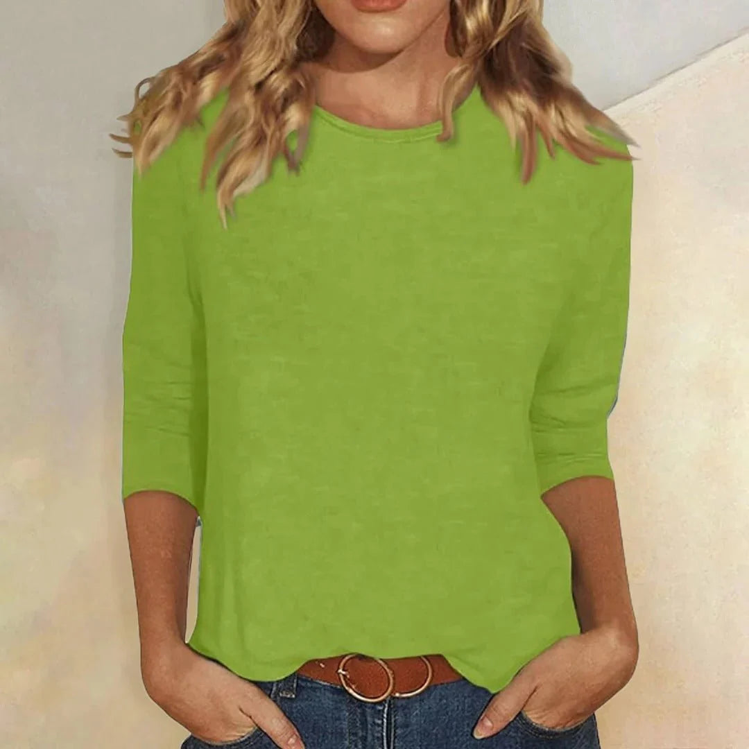 Back view of women's relaxed fit top with crew neckline and three quarter sleeves