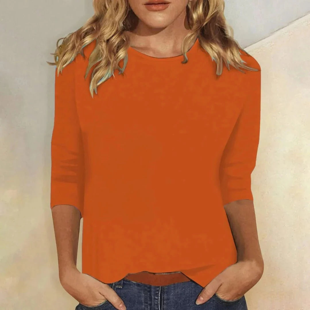 Three quarter sleeve crew neck top demonstrating comfortable fit and classic design