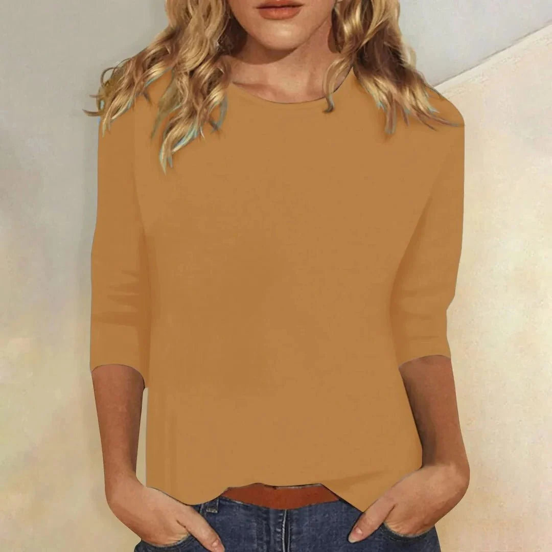 Women's pink crew neck top with round neckline and relaxed body fit