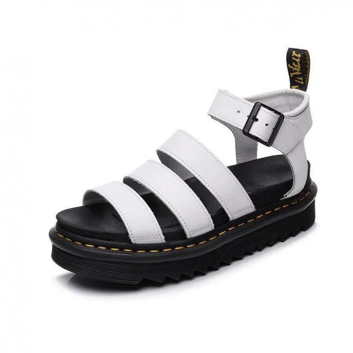 Side view of women's platform sandals showing thick sole with contrast yellow stitching and tread detail