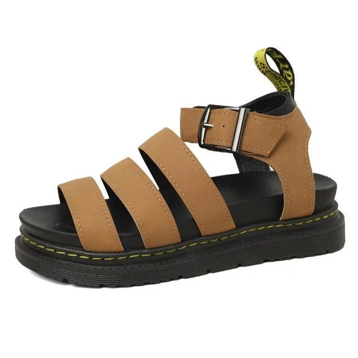 Women's platform sandals displaying multi-strap upper design and raised chunky sole construction