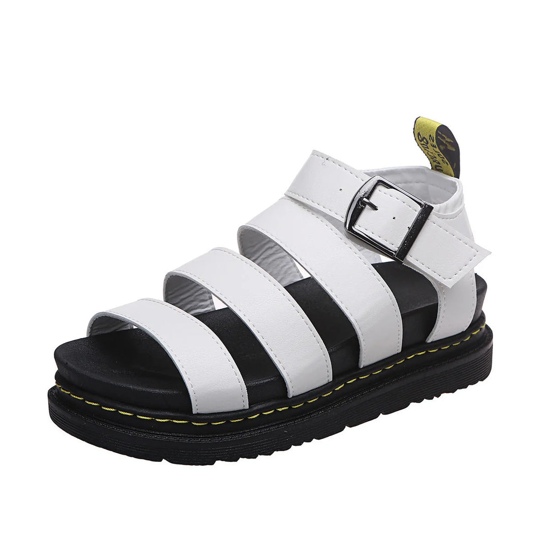 Detail shot of contrast stitching and tread pattern on women's platform sandal sole