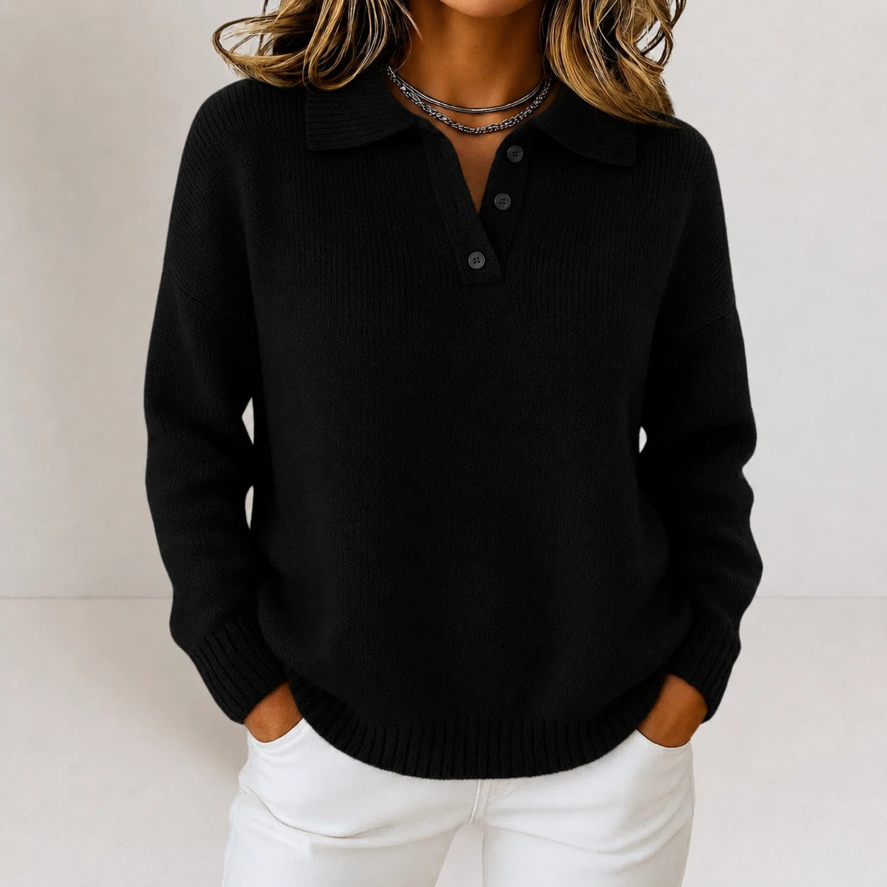 Detail of fine knit texture and smooth finish on women's polo jumper