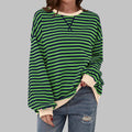 Women's oversized striped jumper in green and navy with contrasting cream ribbed neckline and cuffs