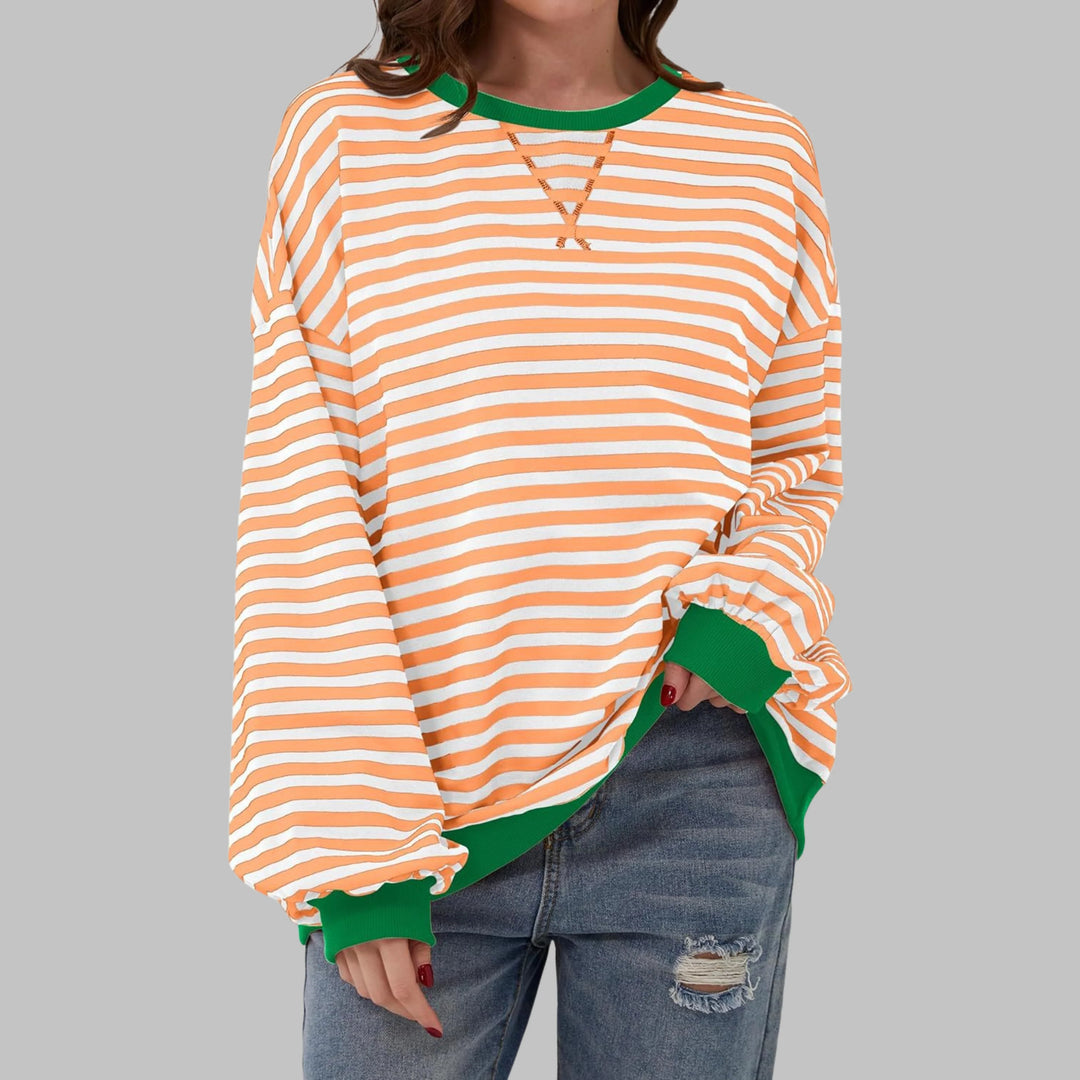 Full-length view of women's relaxed-fit striped jumper with dropped shoulders