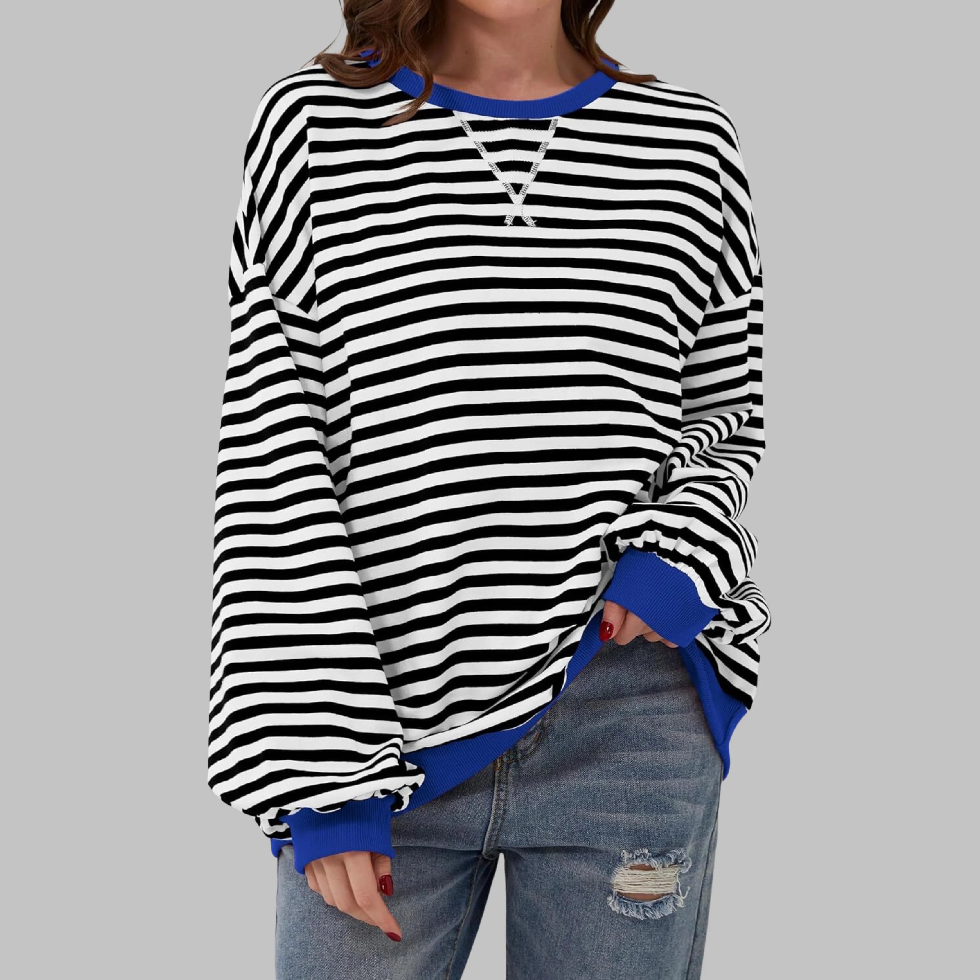 Close-up of relaxed-fit striped jumper showing horizontal stripe pattern and dropped shoulder detail
