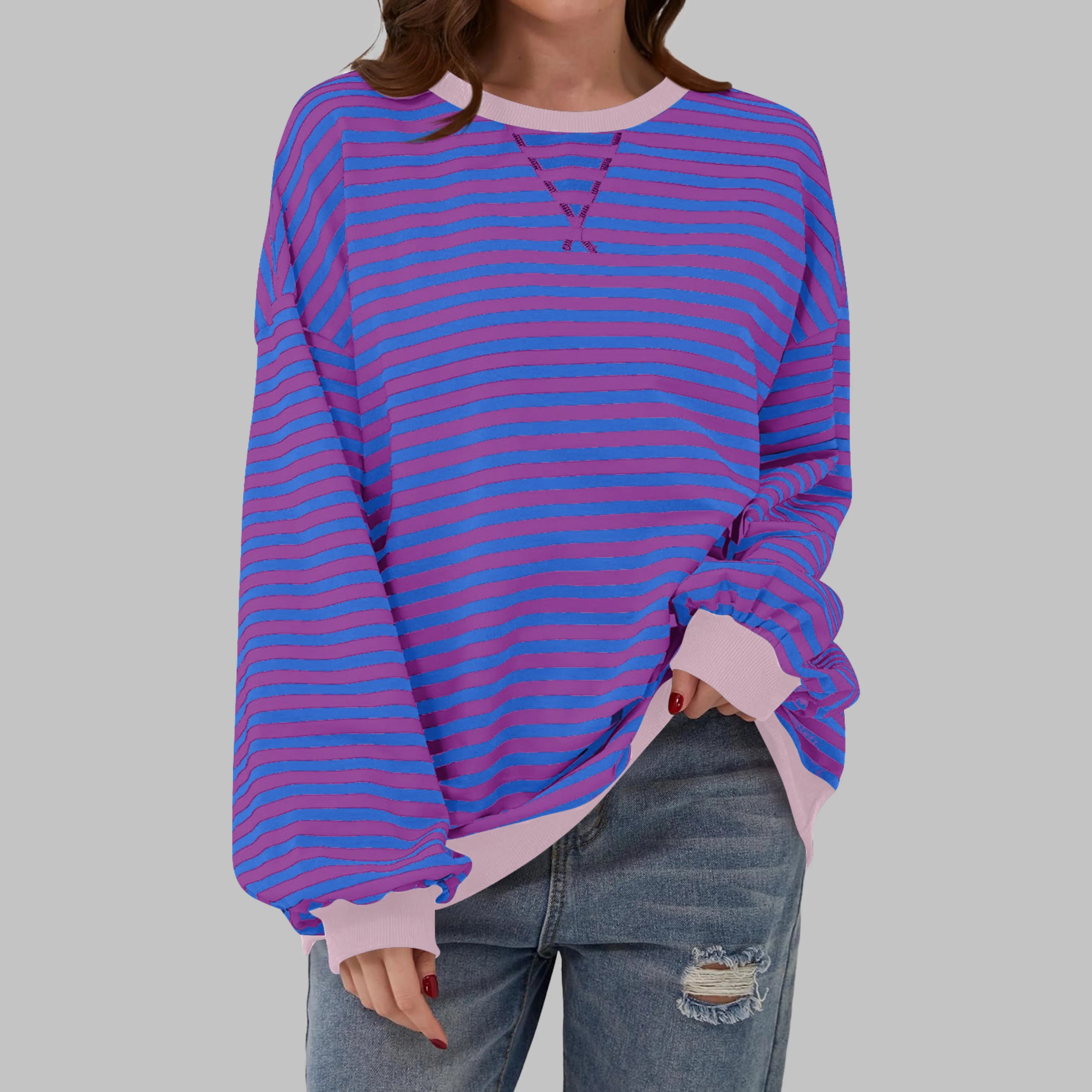 Women's striped jumper paired with casual trousers for everyday wear