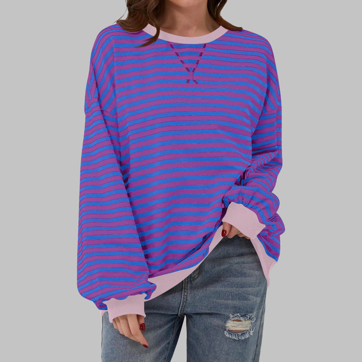 Women's striped jumper paired with casual trousers for everyday wear