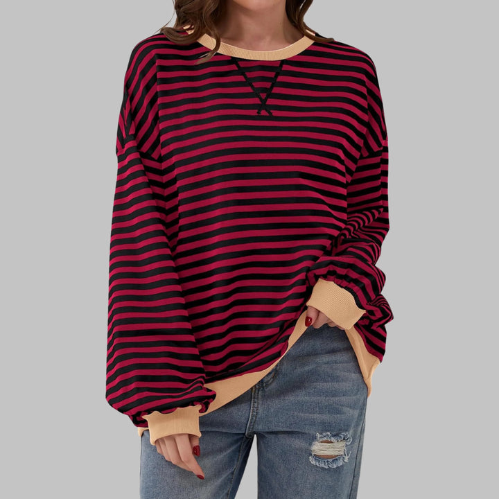 Close-up of crew neckline detail on striped jumper with contrasting ribbed trim
