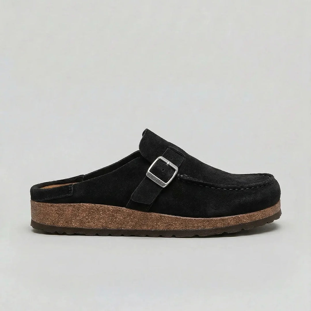 Side view of women's slip-on suede clogs showing contoured cork footbed and durable sole