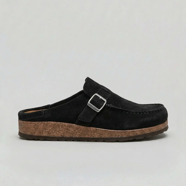 Side view of women's slip-on suede clogs showing contoured cork footbed and durable sole