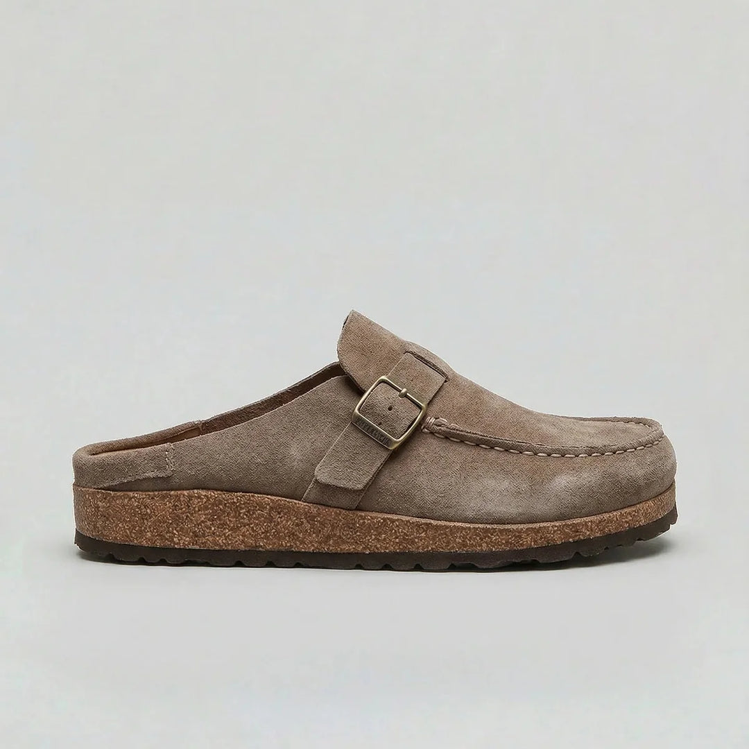 Women's suede clogs styled with casual trousers and ribbed socks for everyday wear