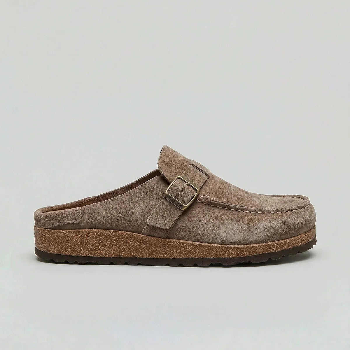 Women's suede clogs styled with casual trousers and ribbed socks for everyday wear