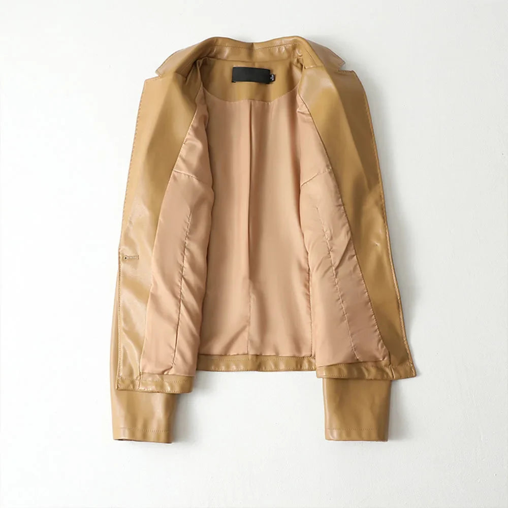 Women's camel blazer detail view highlighting front welt pockets and button closure