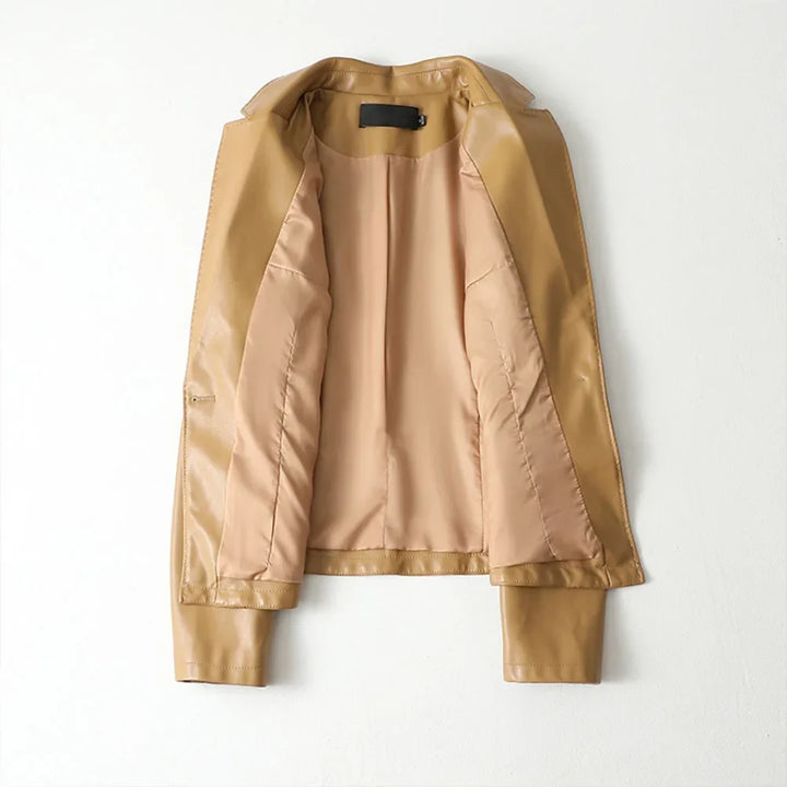 Women's camel blazer detail view highlighting front welt pockets and button closure
