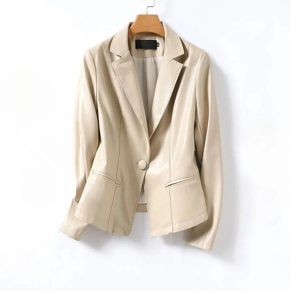 Women's blazer hanging showing full-length sleeves and tailored cut