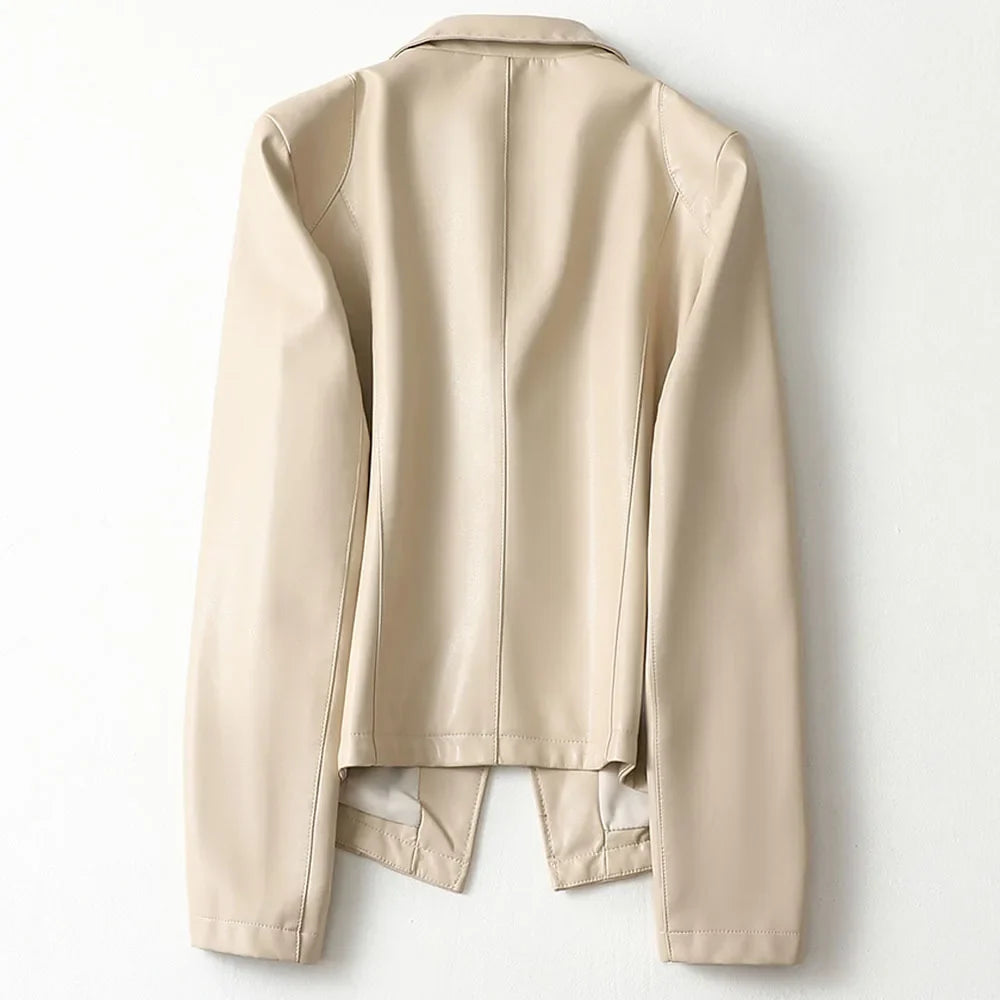 Detail of women's blazer construction with smooth finish and structured shoulders